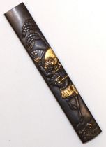 Japanese 17th century Kodzuka grip possibly by Mumia with Samurai on horseback design with gold