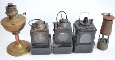 Five vintage metal paraffin lamps to include 3 railway lamps one marked LNER, another BR(E) and