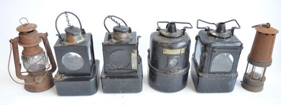 Six vintage metal lamps to include 4 railway lamps (2 marked BR(E) and 2 unmarked but one with 55/