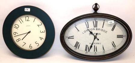 Two modern decorative wall clocks incl. one printed 'London Bridge, Platform 2', max. L50cm