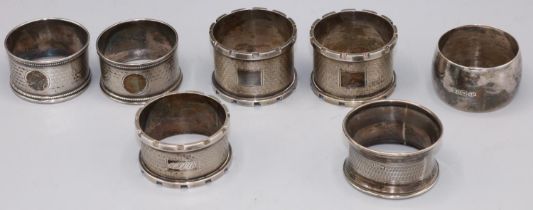 Group of 7 variously marked silver napkin rings, 4.85ozt.