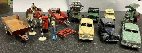 Collection of Dinky diecast vehicle models including farm trailer, tractor with driver, Austin taxi,