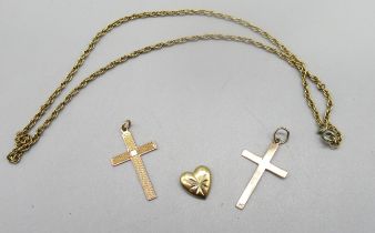 Two 9ct yellow gold crucifix pendants, a 9ct gold heart pendant, all stamped 9k, and a 9ct yellow