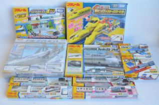 Collection of boxed Japanese Imported Takara Tomy battery operated plastic model train sets to