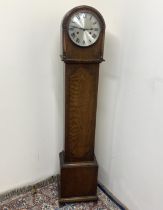 Hamburg American Clock Co., oak grand daughter longcase clock, silvered Roman dial, two train