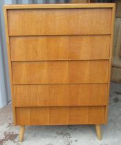 1960s teak finish chest of five drawers on turned tapering outsplayed supports, W77cm D40cm H114cm