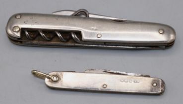 Silver pocket knife with folding blade, hallmarks are rubbed, L9.5cm, another smaller pocket