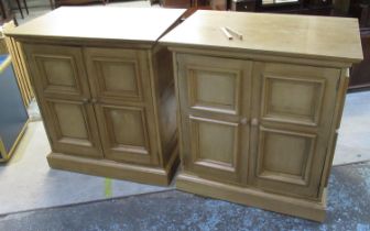 Pair of pine two door cupboards with shelved interiors, on plinth bases with casters, W92cm D60cm