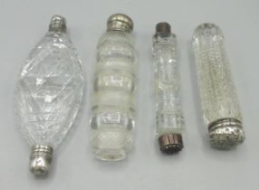 Four late C19th/early C20th cut glass scent bottles incl. two double ended examples, comprising