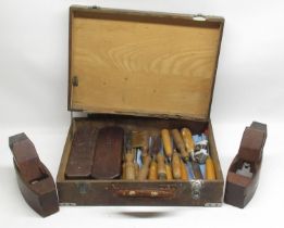 Two vintage smoothing planes, two similar period cased sharpening stones and woodworking chisels