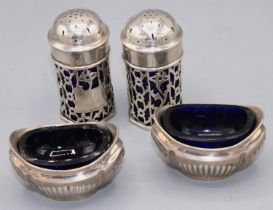 Pair of oval salts and a pair of Edwardian pepperettes with Bristol blue liners. Salts,