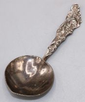 Silver tea caddy spoon, American, by Gorham Heart shaped bowl, tapered handle cast with a fish