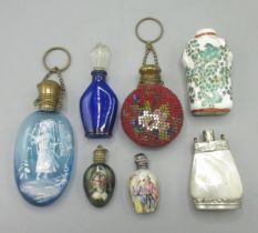 Collection of scent bottles, incl. two porcelain bottles with hallmarked silver tops, a glass bottle