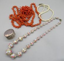 Two coral necklaces, a painted bead necklace, a string of pearls with a silver clasp, and a
