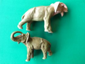 Two Royal Dux models of elephants, (2)