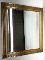 Regency style gilt wall mirror, bevel square plate in reeded frame with draught turned corners, 63cm
