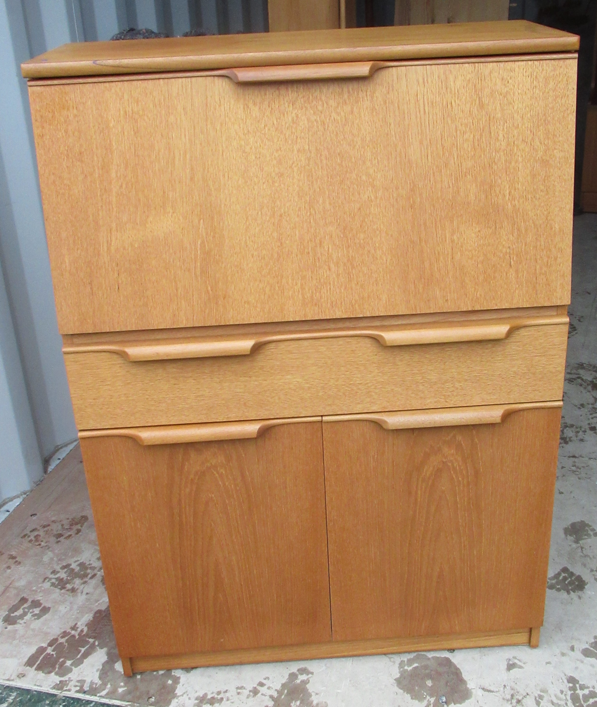 Mid century teak finish bureau, fall front with fitted interior a door and two drawers W78cm D36cm