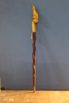 David Hames - a walking stick with twist carved shaft and rodent carved handle, signed on metal