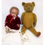 Large yellow plush teddy bear, with leather arm and footpads and brown glass eyes, H73cm, and a