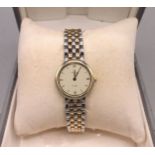 Ladies Omega De Ville stainless steel and gold plated quartz wristwatch on integrated bracelet,