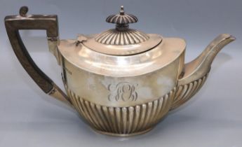 Edwardian Silver tea pot with lobed decoration and a ebonised handle, Sheffield, 1905, James