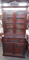 Edwardian mahogany secretaire bookcase, carved cornice above two glazed doors a fitted fall front