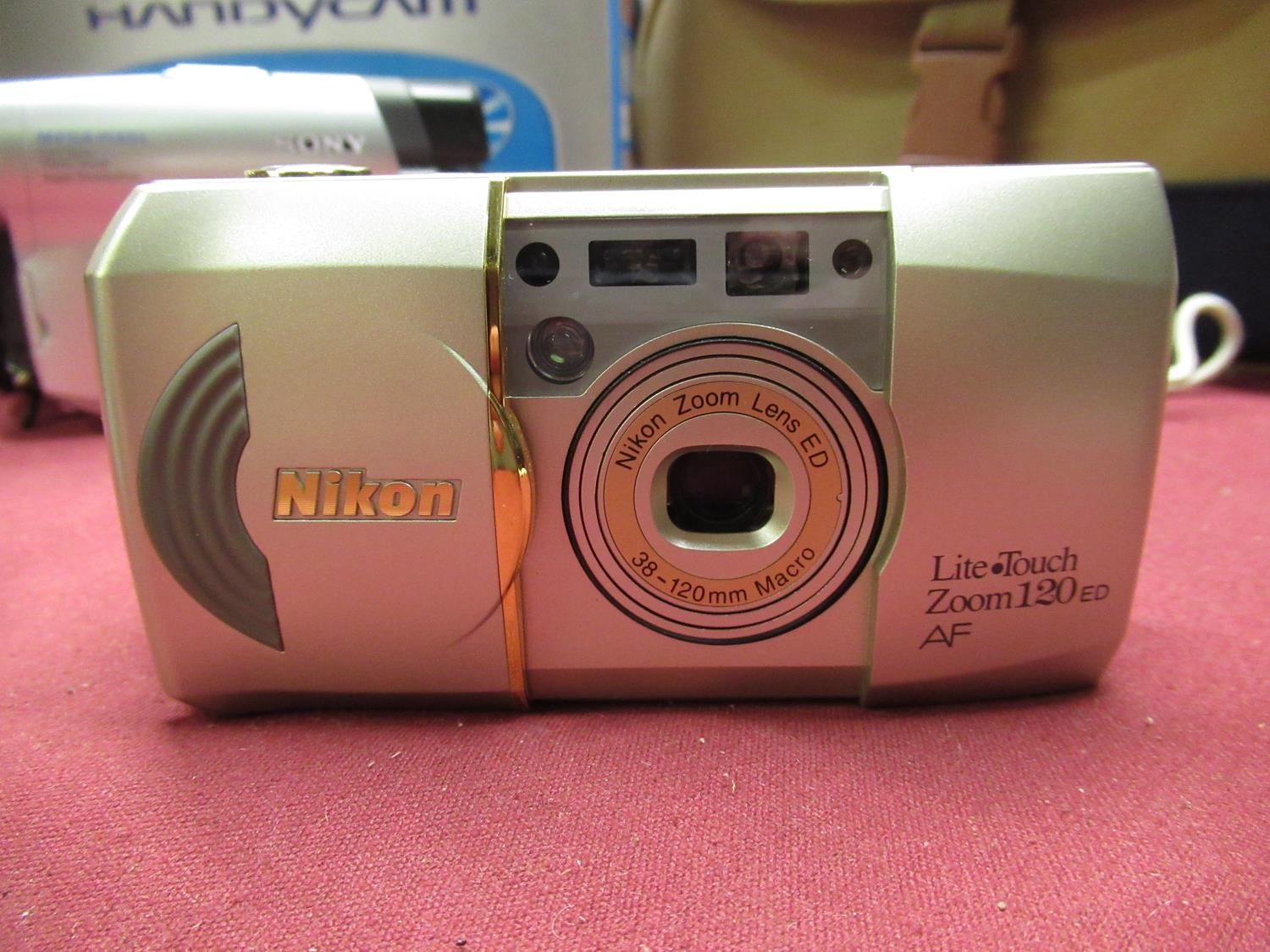 Sony DVD 201E DVD camcorder with box, charger, case etc, and a Nikon Lite Touch zoom 120 35mm camera