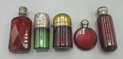 Collection of ruby and green coloured glass scent bottles, incl. three with hallmarked silver