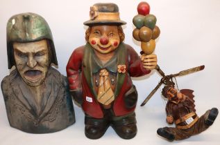 Carved wood bust of a screaming man, H60cm, resin figure of a clown, and a similar figure of an