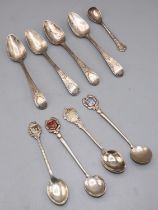 Collection of five Victorian silver souvenir spoons, a set of four Victorian teaspoons and a