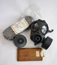 An ex-British Army Avon 1990 twin port gas respirator with 2 cartridges (appears unused), a set of