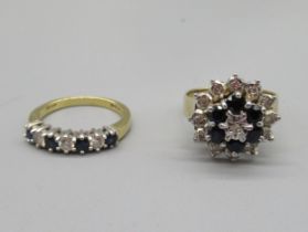 18ct yellow gold ring set with three diamonds and four sapphires, stamped 750, size K, 3.09g, and