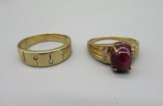 9ct yellow gold band ring set with diamonds, size T1/2, and a 9ct gold ring set with cabochon ruby