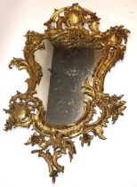 Chippendale style gilt painted cast metal framed wall mirror, with scroll and cartouche