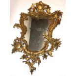 Chippendale style gilt painted cast metal framed wall mirror, with scroll and cartouche