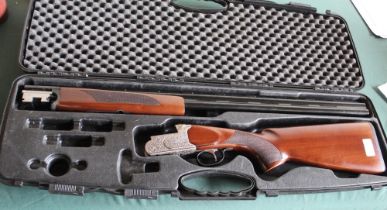 20B Revo over under non ejector shotgun with 30" barrels, overall length 47 1/2", in own padded