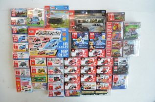 Fifty boxed Japanese imported small scale Takara Tomy diecast models to include TV/film related