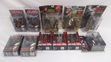 Collection of NECA and McFarlane figures from the Evil Dead universe, all cased/boxed, overall