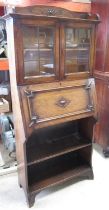 C20th Ray & Miles oak bureau bookcase, two lead glazed doors above fall front and two shelves, W77cm