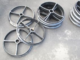 Set of Seven cast iron wheels. Various sizes