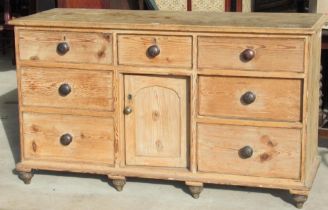 Victorian pitch pine dresser, with seven drawers and a cupboard, turned wooden handles and feet,