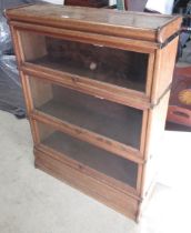 C20th oak Globe-Wernicke three tier book case, with glazed doors on plinth base, W87cm D28cm H116cm