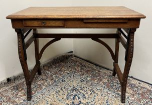 Victorian oak rectangular writing table, with frieze drawer and slide, on carved scroll supports,