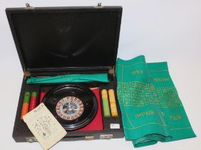 K&C Ltd roulette wheel with chips and playing baize, in fitted case, wheel D25cm