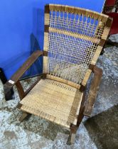 Mid-Century Danish teak rocking chair with woven seat and back, marked JK, stamped Made in