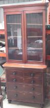 Victorian oak and mahogany bookcase on chest, with two glazed doors above two short and three long