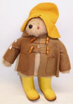 A Gabrielle designs Paddington bear with brown duffle coat, yellow hat and rain boots, Height approx