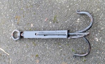 Cast iron pan hooks, a chain dog collar and a fleem