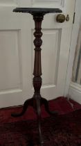 George III style mahogany tripod torchere, circular top with carved rim on lobed column supports and