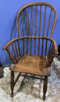 C19th ash and elm stick back Windsor arm chair, on turned supports with stretchers